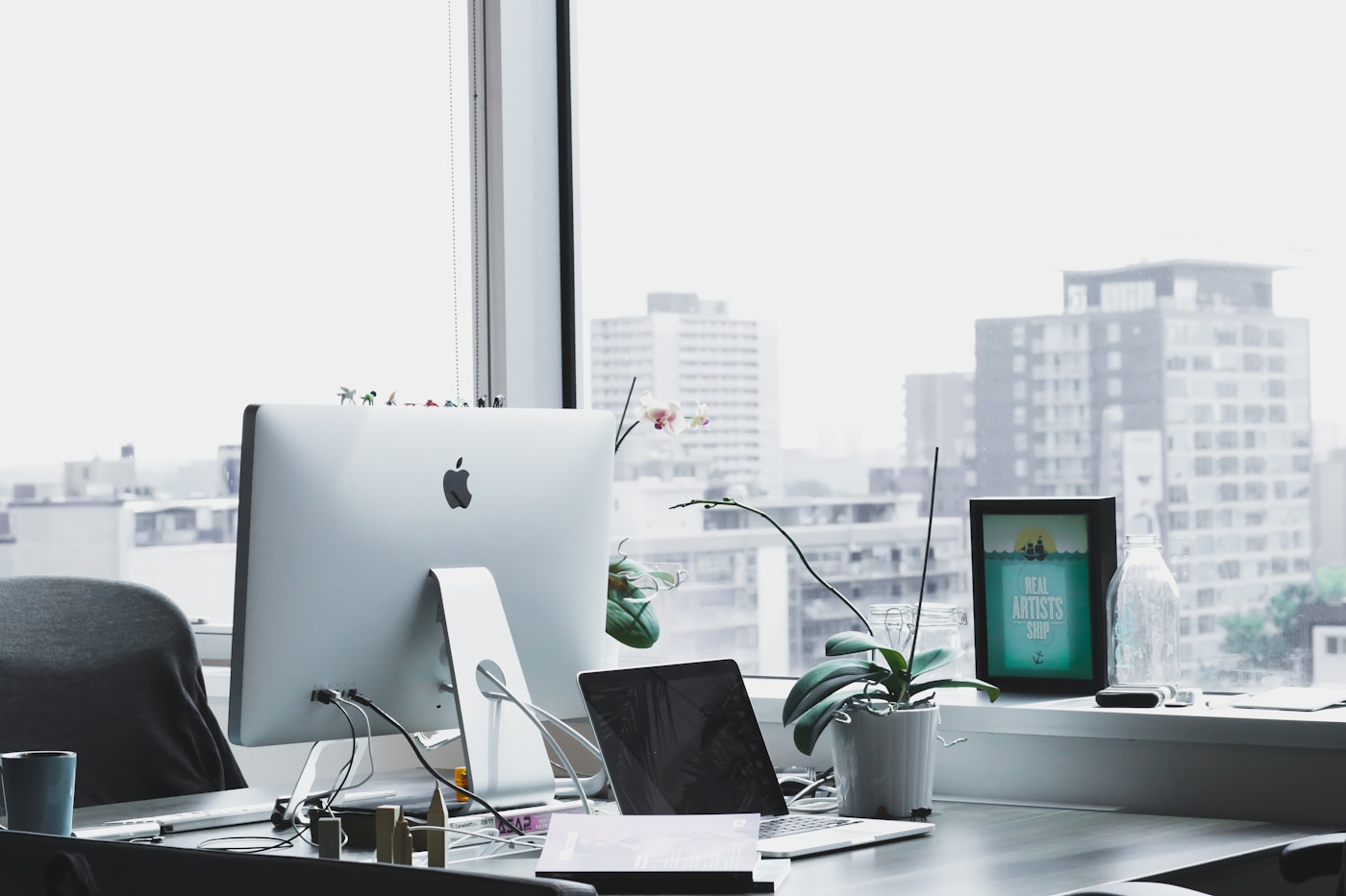 Design desk with e-commerce brand identity explorations and colour chips